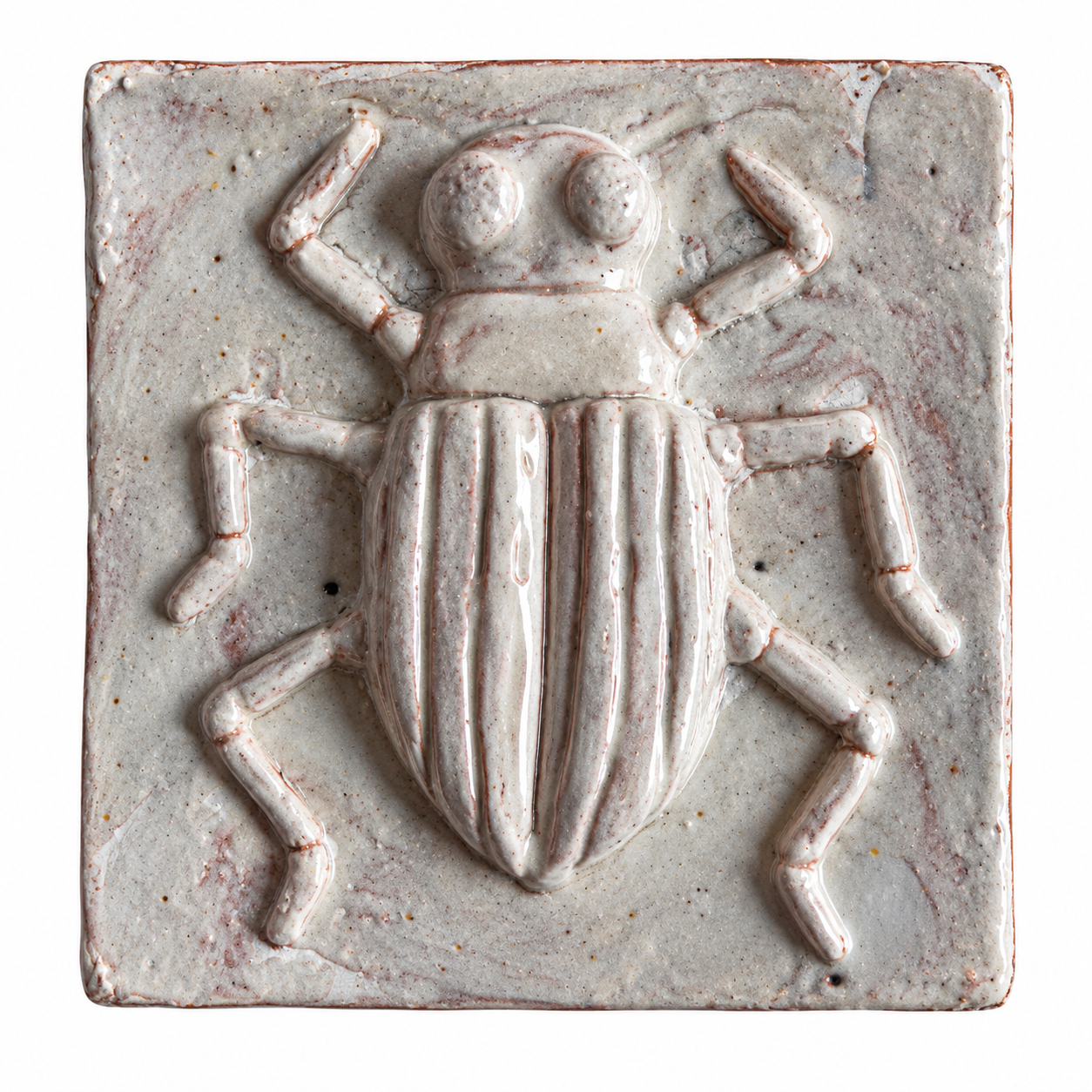 Pale glazed ceramic tile with a raised striped beetle design