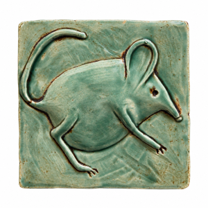 Celadon green ceramic tile with a raised mouse design and curved tail
