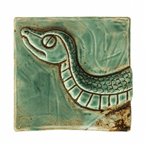 Celadon green ceramic tile with a raised snake design